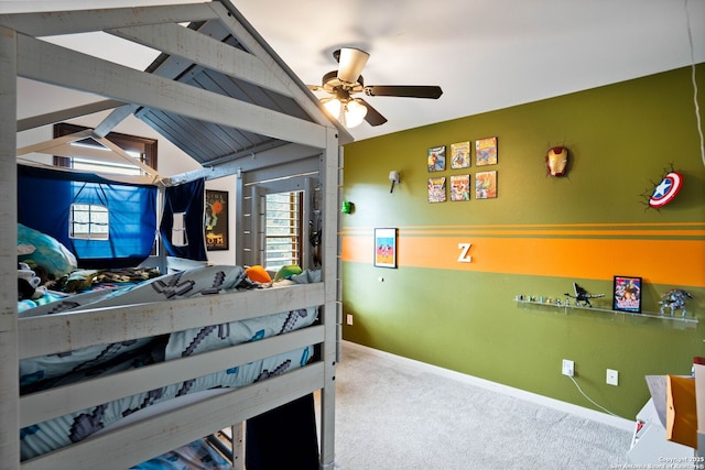 carpeted bedroom featuring vaulted ceiling with beams and baseboards
