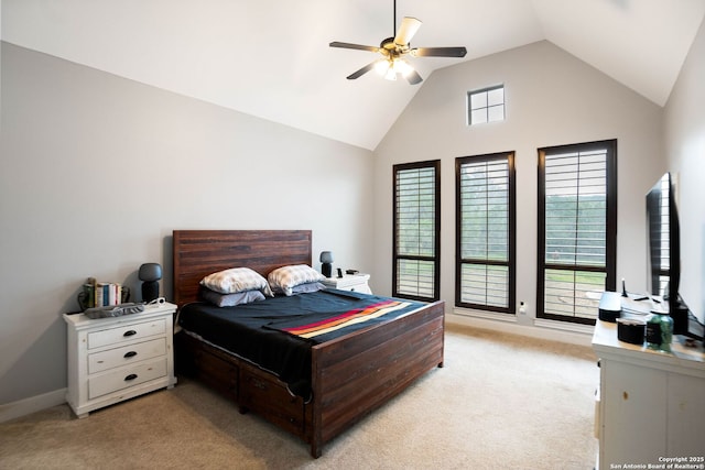 bedroom featuring lofted ceiling, light colored carpet, baseboards, and ceiling fan