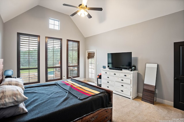 bedroom with a ceiling fan, light colored carpet, baseboards, and high vaulted ceiling