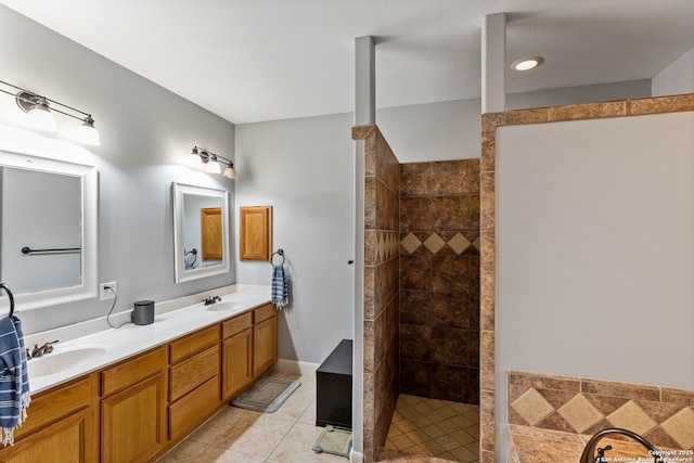 full bath featuring tile patterned flooring, double vanity, a walk in shower, and a sink