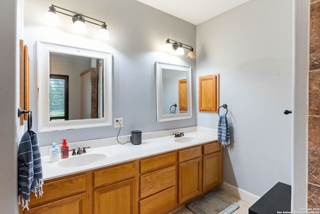 full bath with double vanity and a sink