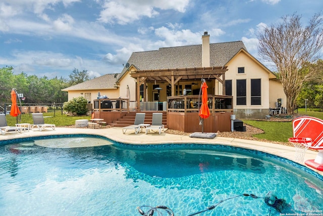 view of swimming pool with a fenced in pool, a patio, a wooden deck, and fence