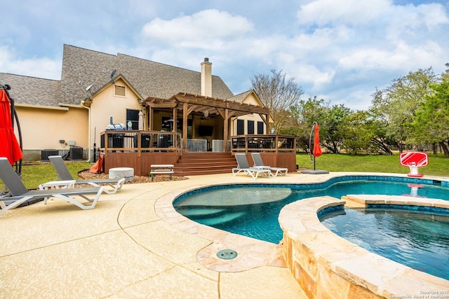 view of pool featuring a patio, a lawn, a pergola, and a wooden deck