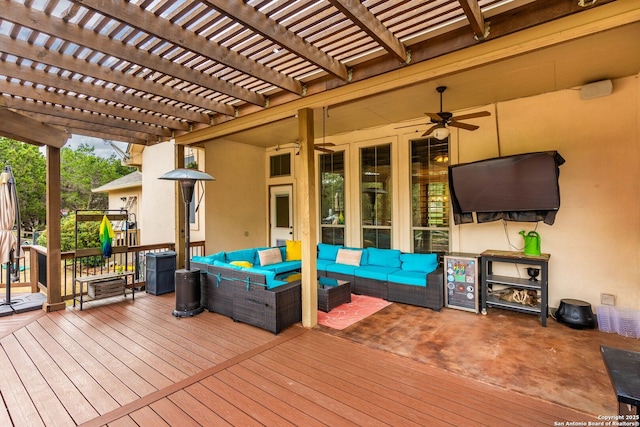 wooden deck featuring a ceiling fan, a pergola, and an outdoor hangout area