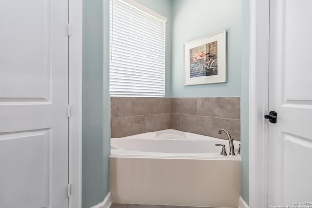 bathroom with a bath and a wealth of natural light