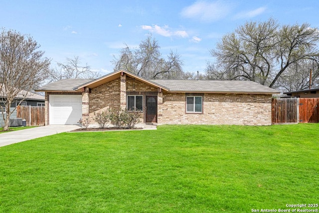 view of front of house with brick siding, driveway, a front yard, and fence