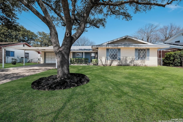 ranch-style home with a front yard, an attached garage, brick siding, and driveway