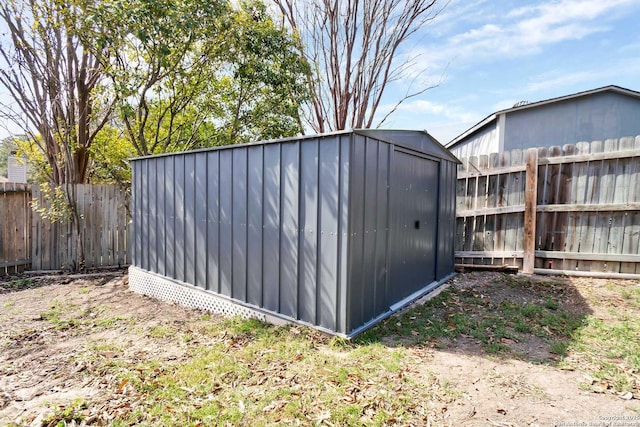 view of shed featuring a fenced backyard