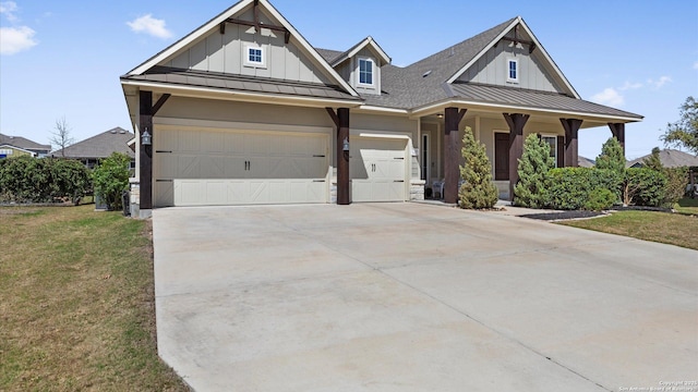 modern farmhouse style home featuring a front yard, board and batten siding, driveway, and a standing seam roof