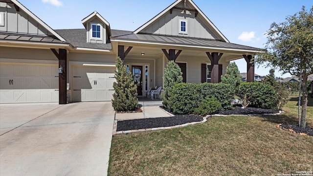 modern farmhouse style home with covered porch, board and batten siding, concrete driveway, and a standing seam roof