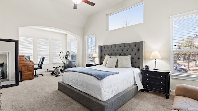 carpeted bedroom featuring baseboards, ceiling fan, and vaulted ceiling