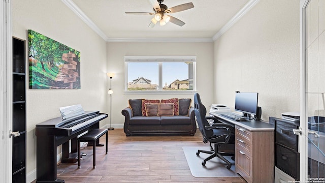 home office with ceiling fan, baseboards, wood finished floors, and crown molding