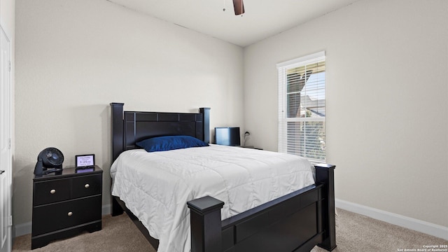 bedroom with carpet flooring, a ceiling fan, and baseboards