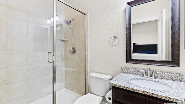 full bath featuring toilet, ensuite bath, a shower stall, vanity, and a textured wall