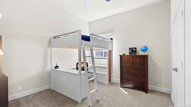 bedroom featuring baseboards and carpet floors