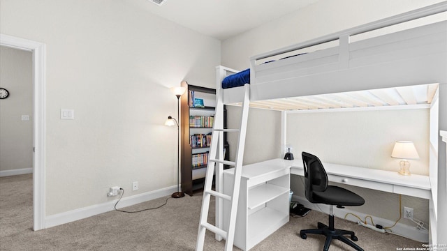 bedroom featuring carpet flooring and baseboards