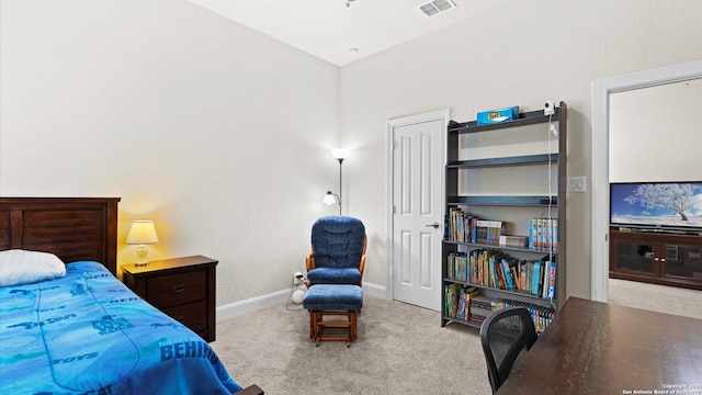 carpeted bedroom with visible vents and baseboards