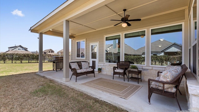 view of patio / terrace with an outdoor living space, area for grilling, and ceiling fan