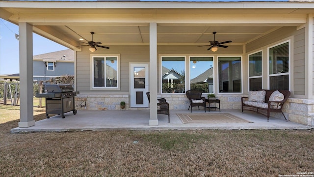 view of patio featuring a grill and ceiling fan