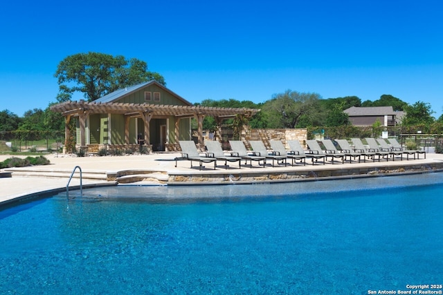 view of pool with a patio area and a pergola