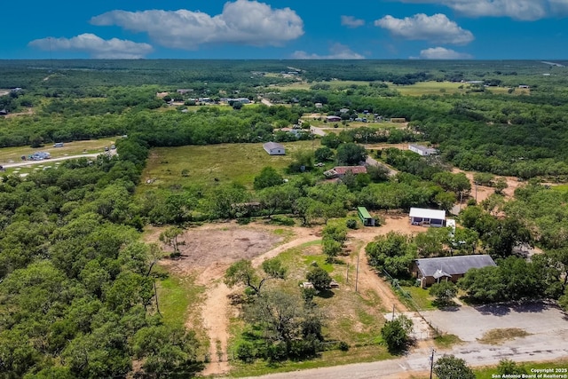 drone / aerial view with a view of trees