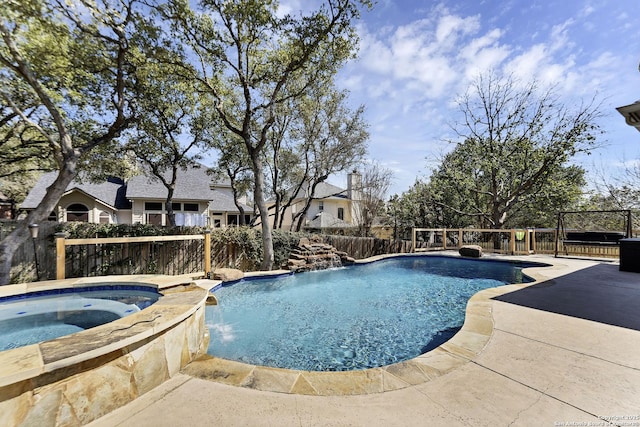 view of swimming pool with a fenced in pool, an in ground hot tub, a fenced backyard, and a patio