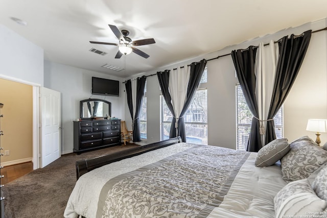 bedroom with visible vents, baseboards, and ceiling fan