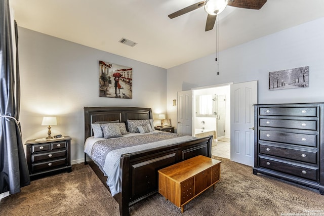 bedroom with visible vents, ensuite bathroom, freestanding refrigerator, carpet flooring, and ceiling fan