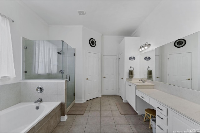 bathroom with visible vents, a shower stall, ornamental molding, a bath, and vanity