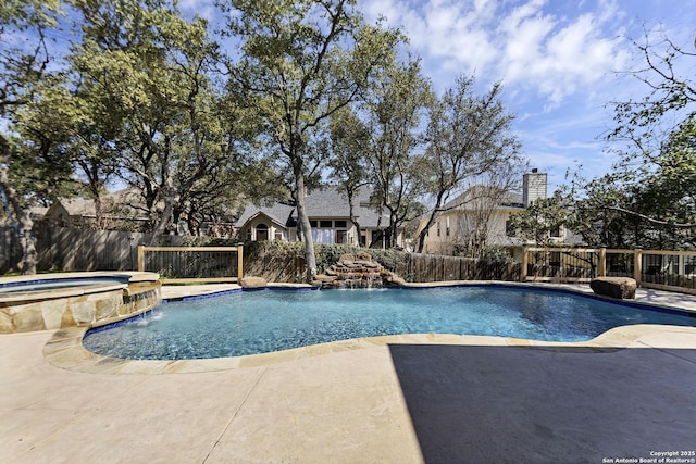 view of swimming pool with a patio, a pool with connected hot tub, and a fenced backyard