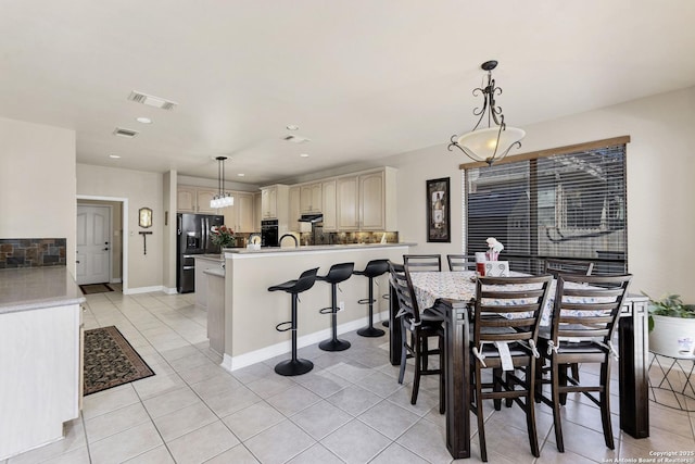 dining space with recessed lighting, visible vents, baseboards, and light tile patterned flooring