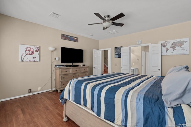 bedroom featuring baseboards, visible vents, dark wood-style flooring, and ceiling fan