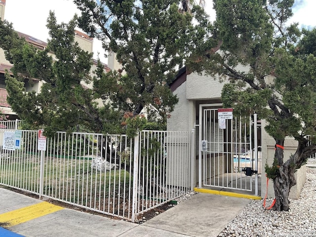 view of gate with fence