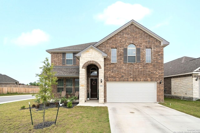 view of front of home with brick siding, an attached garage, a front lawn, stone siding, and driveway