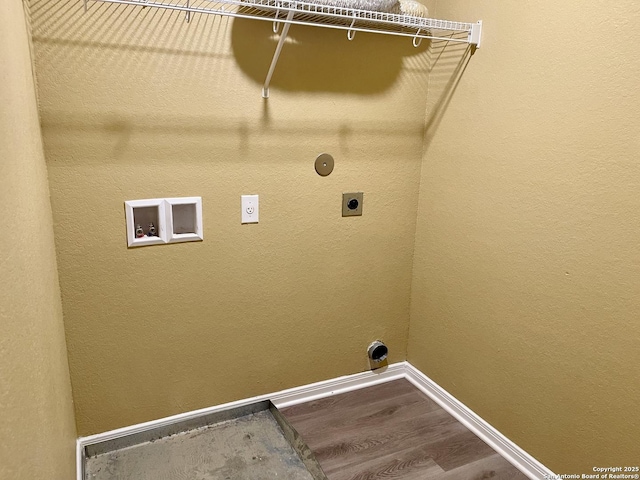 washroom with wood finished floors, baseboards, hookup for an electric dryer, hookup for a washing machine, and laundry area