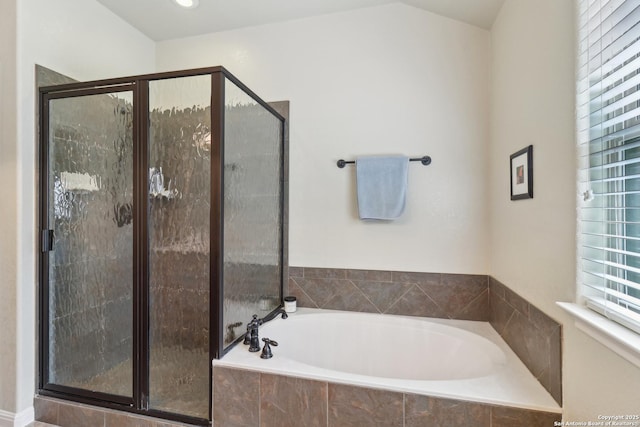 full bath with a garden tub and a shower stall