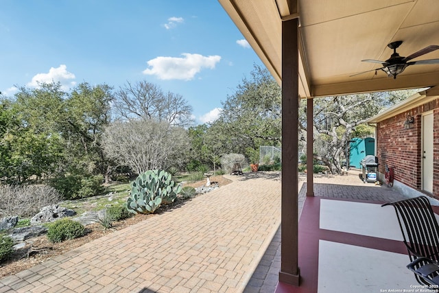 view of patio / terrace with grilling area and ceiling fan