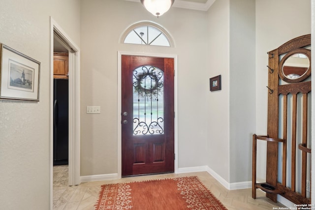 foyer entrance with baseboards