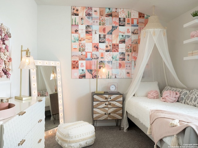 bedroom with carpet flooring and vaulted ceiling