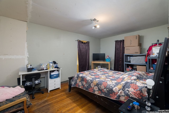 bedroom featuring wood finished floors