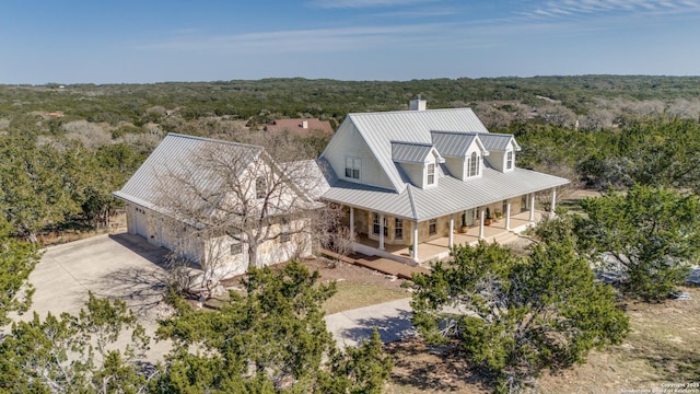 aerial view featuring a wooded view