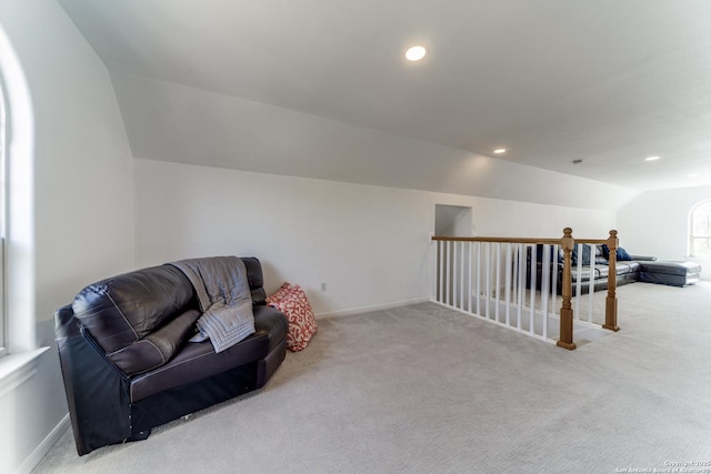 sitting room featuring carpet, baseboards, lofted ceiling, recessed lighting, and an upstairs landing