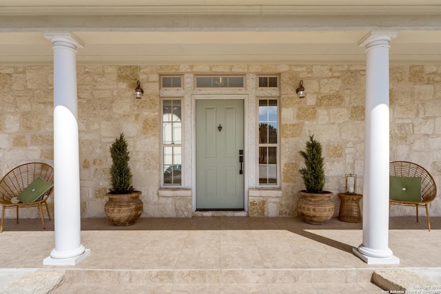 property entrance with stone siding