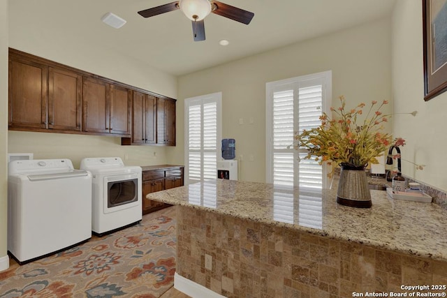 laundry area with cabinet space, independent washer and dryer, and ceiling fan