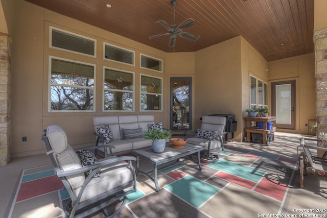 view of patio with outdoor lounge area and a ceiling fan