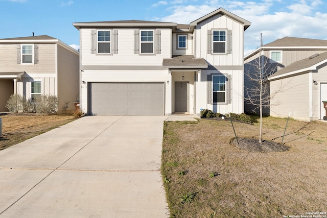 view of front facade featuring an attached garage, board and batten siding, and driveway