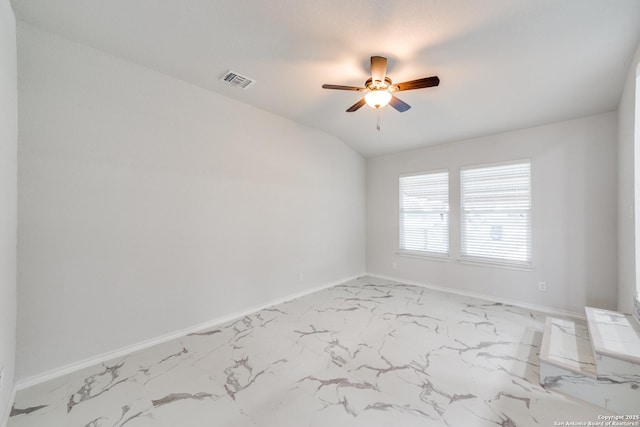 empty room with visible vents, baseboards, marble finish floor, and ceiling fan