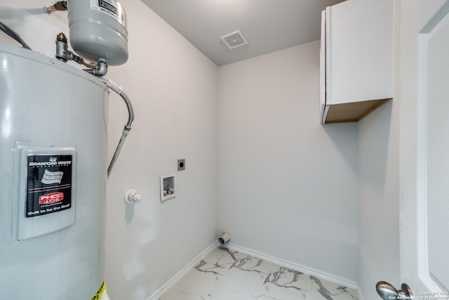 laundry area with electric water heater, baseboards, cabinet space, hookup for an electric dryer, and marble finish floor