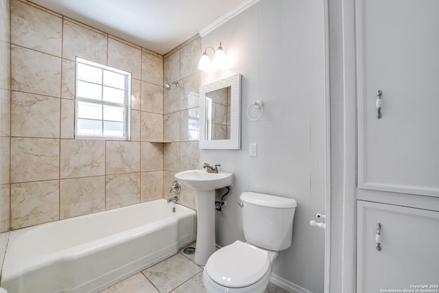 full bathroom featuring toilet, washtub / shower combination, and a sink