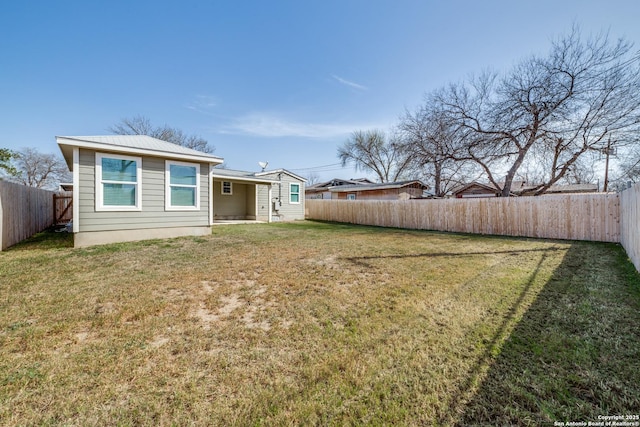 view of yard with a fenced backyard